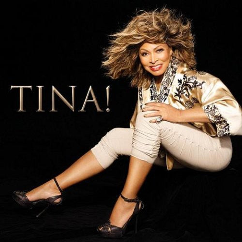 Person in stylish outfit with 'TINA!' text on a black background