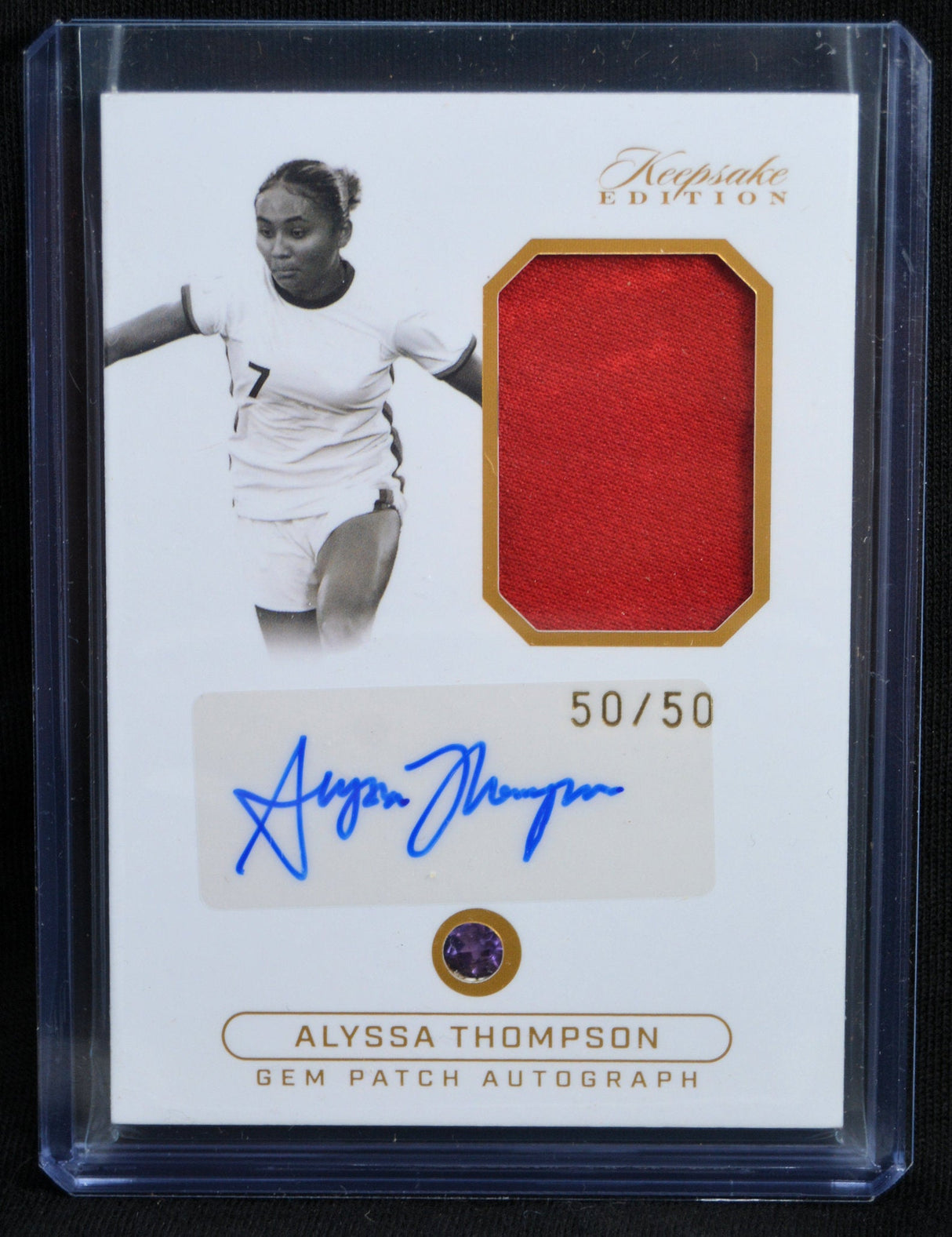 Front of Alyssa Thompson Gem Patch Autograph card with red relic, signature, and 50/50 serial number