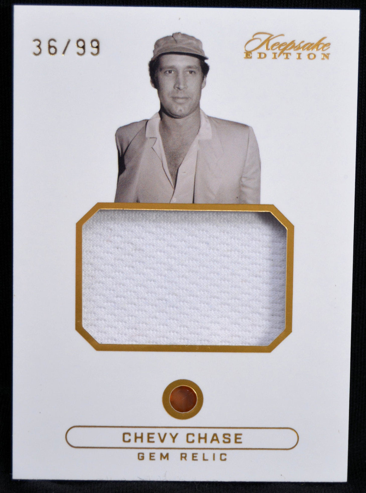 Limited edition Chevy Chase gem relic card, number 36/99, with fabric and classic photo