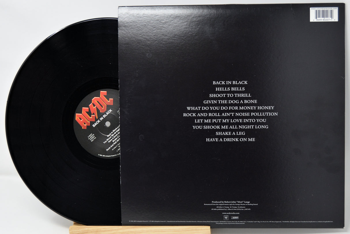 Black vinyl record with red logo and text on a white background