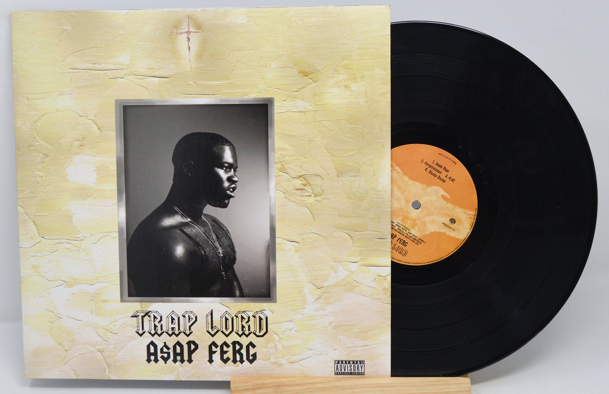 Used vinyl record of A$AP Ferg - Trap Lord album with a visible split in the center.