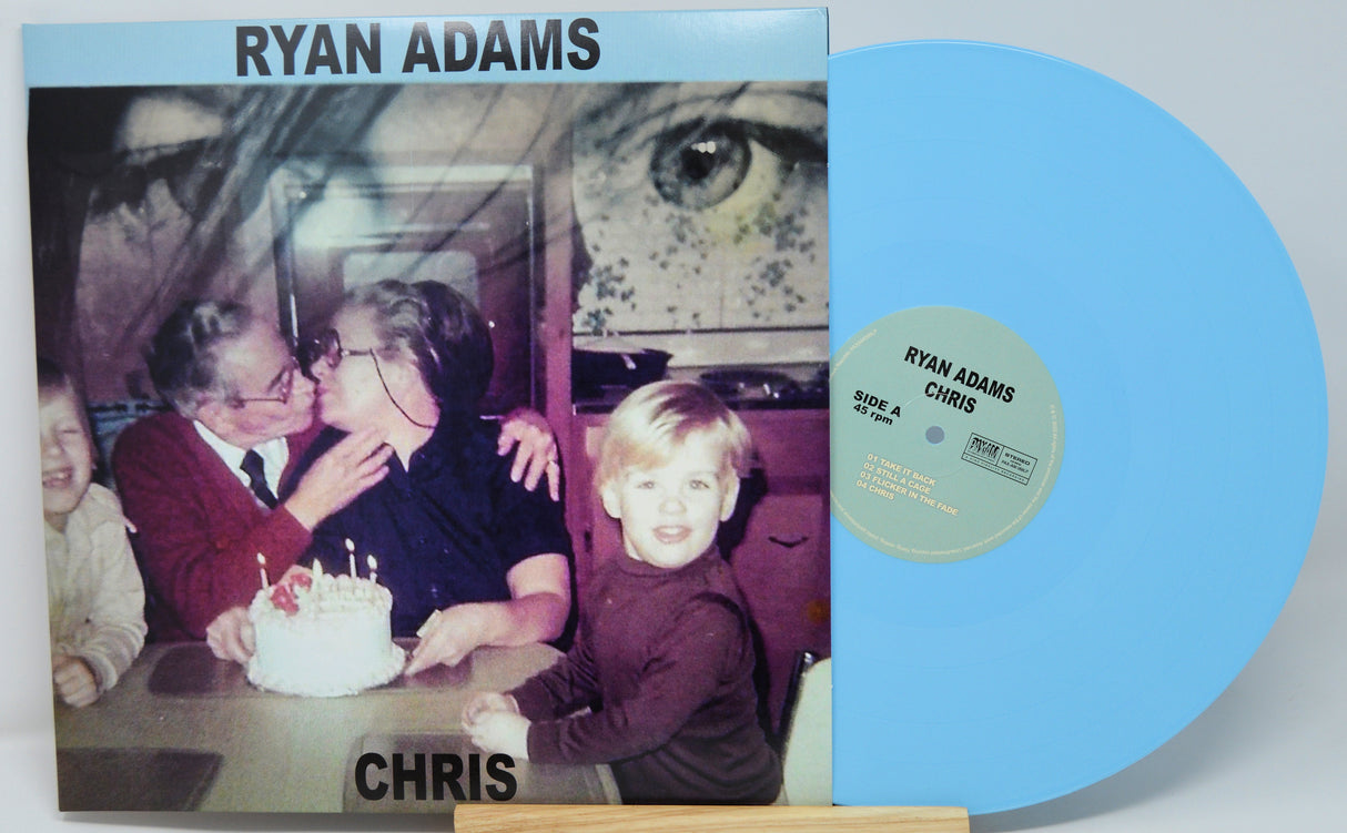 Vinyl record with cover featuring a family photo and 'Ryan Adams' text.