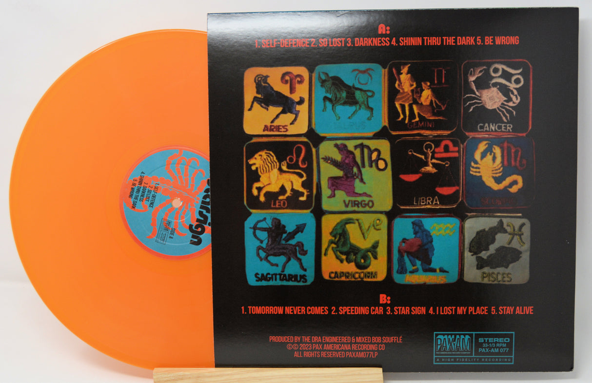 Vinyl record with zodiac symbols on the cover