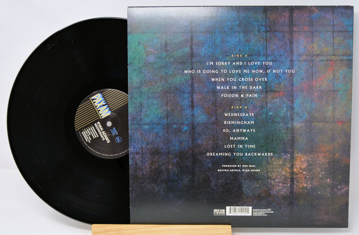 Vinyl record with cover featuring a forest design and tracklist.