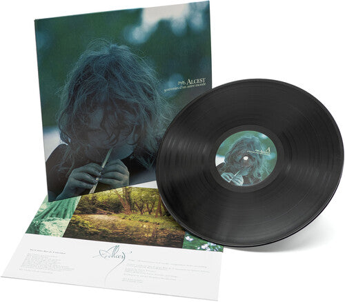 A black vinyl record album titled 'Alcest - Souvenirs D'Un Autre Monde' with a cover image of a person's face partially visible among nature elements.