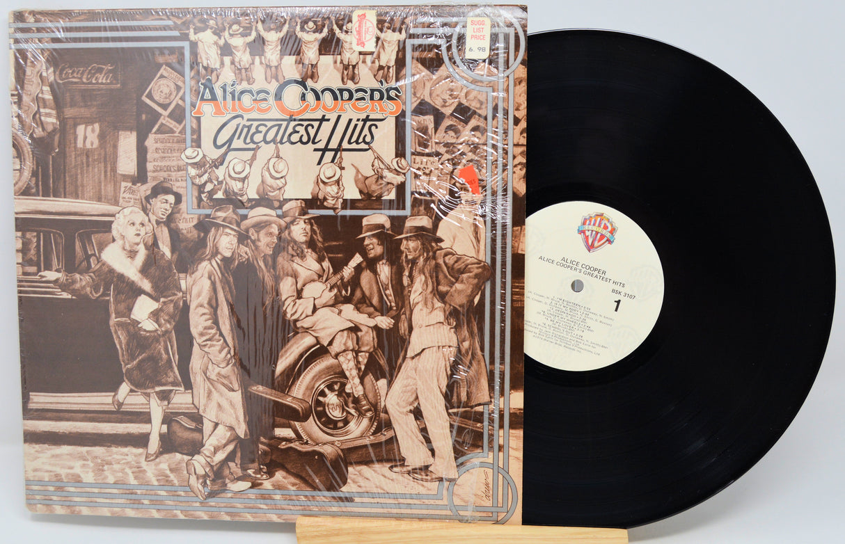 Vinyl record with cover featuring a group of people and 'Alice Cooper's Greatest Hits' text.