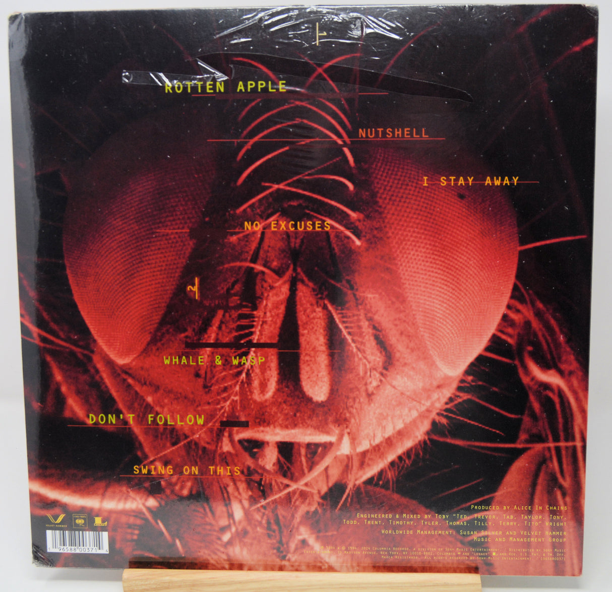 Vinyl record cover with red and black design and text