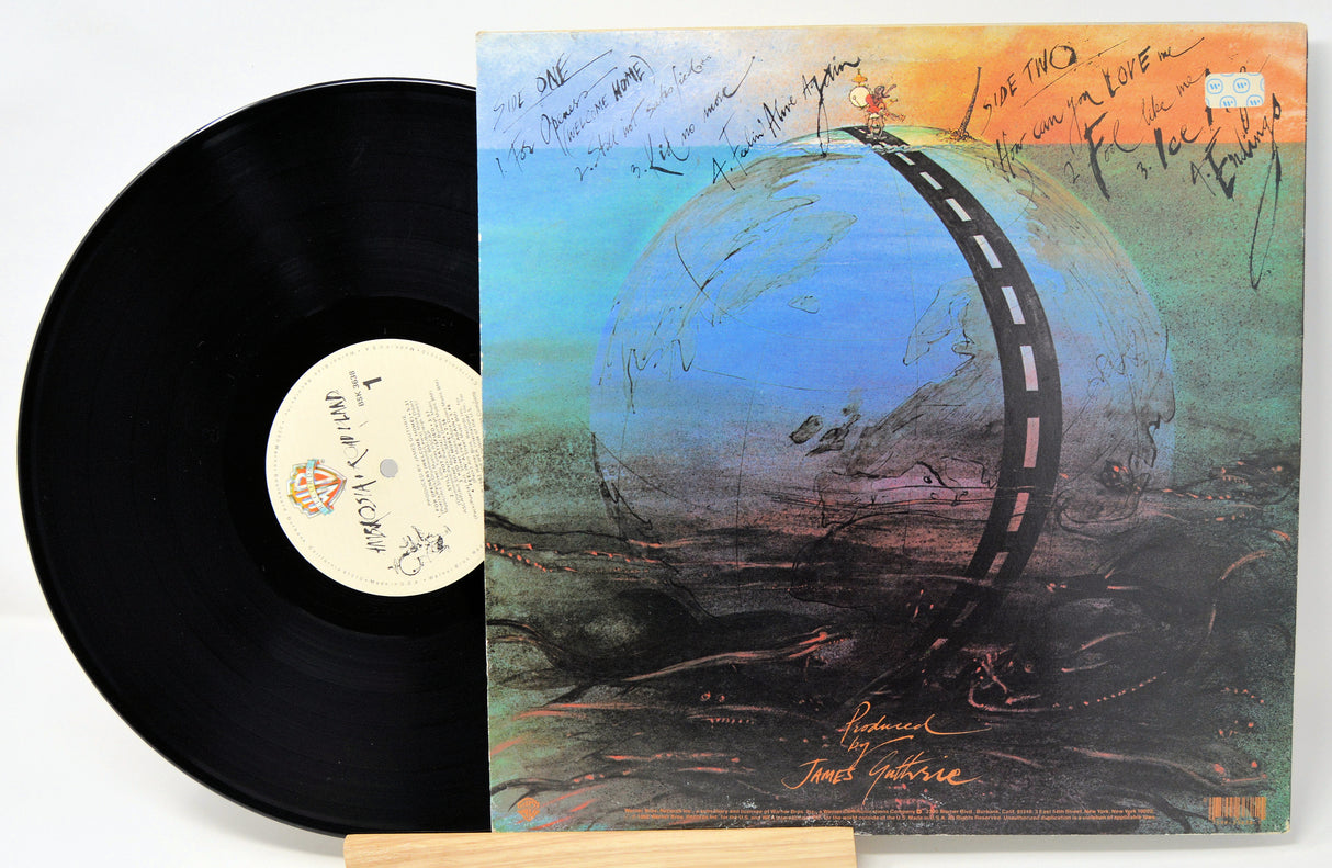 Vinyl record with a colorful album cover featuring a road around a planet.