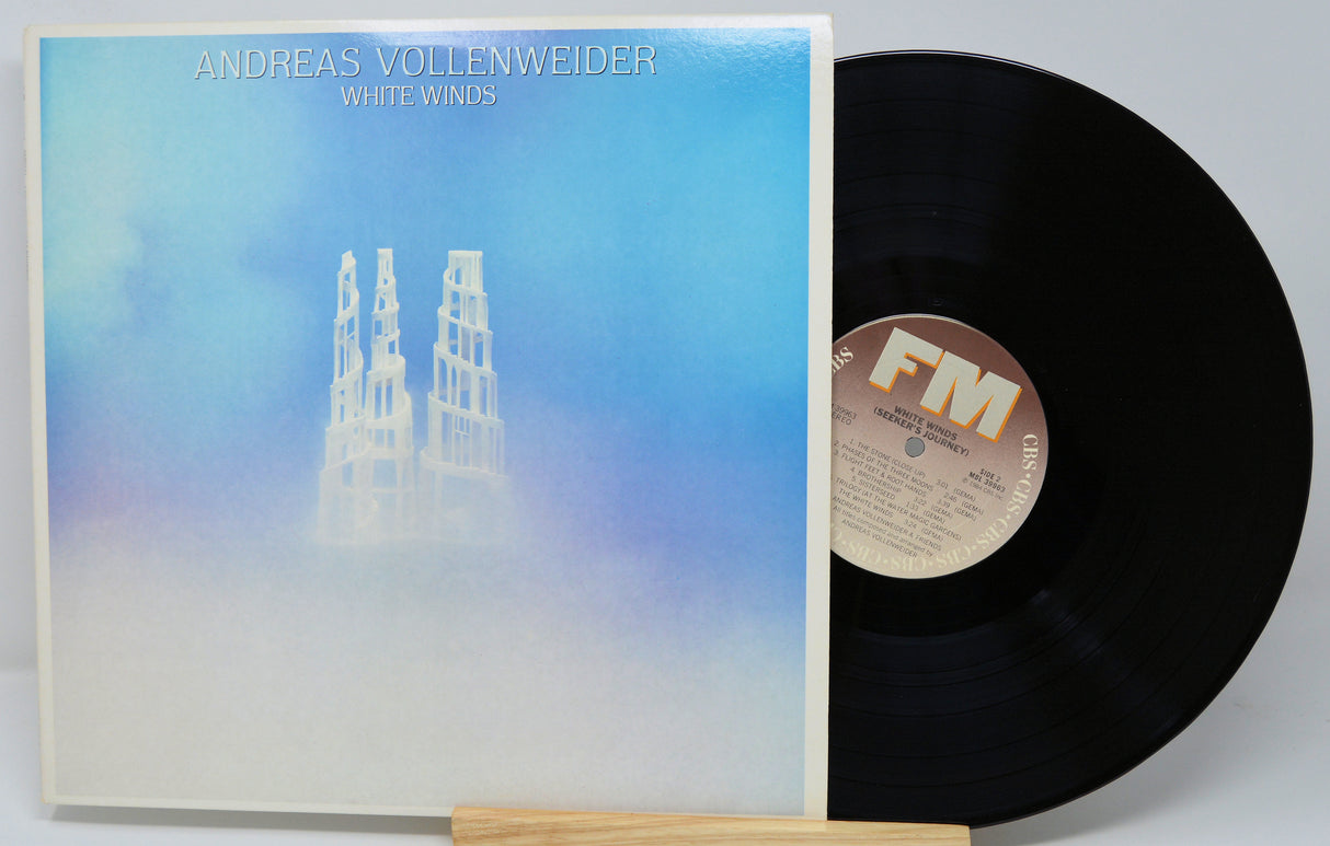 Vinyl record with cover featuring 'Andreas Vollenweider White Winds' on a white background