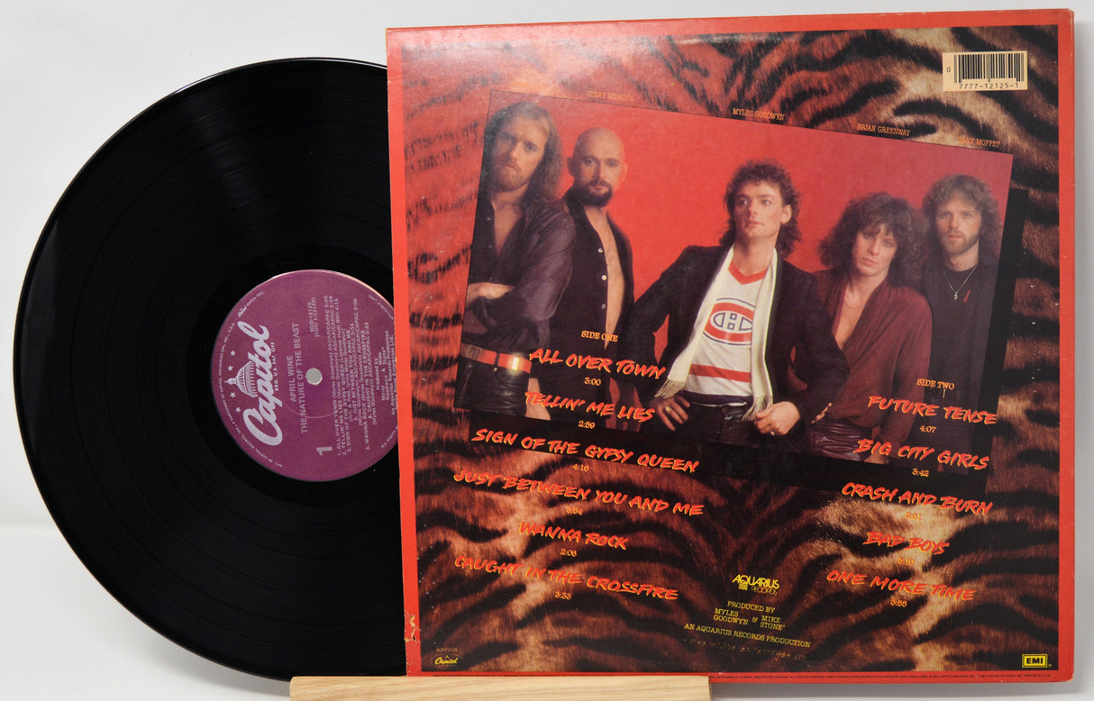 Vinyl record with a colorful cover featuring a band and text.