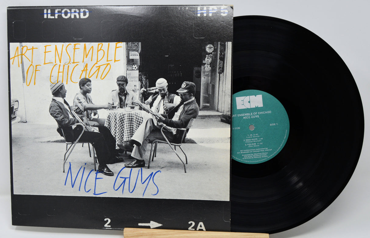 Vinyl record with 'Art Ensemble of Chicago' album cover featuring a group of people around a table.
