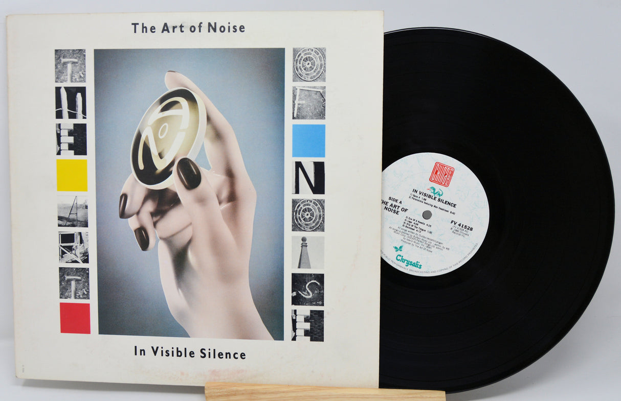 Vinyl record and cover of 'The Art of Noise In Visible Silence' on a white background
