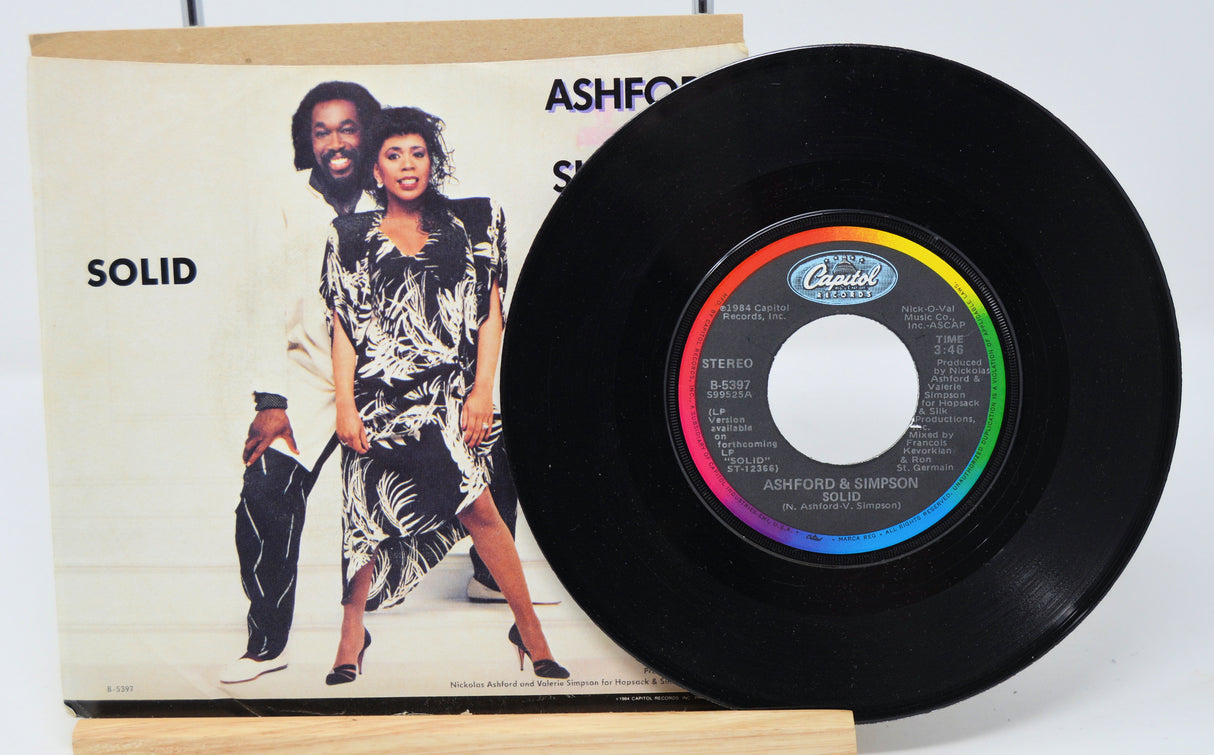 A vinyl record of Ashford & Simpson - Solid with the album cover showing the artists and the title of the album.