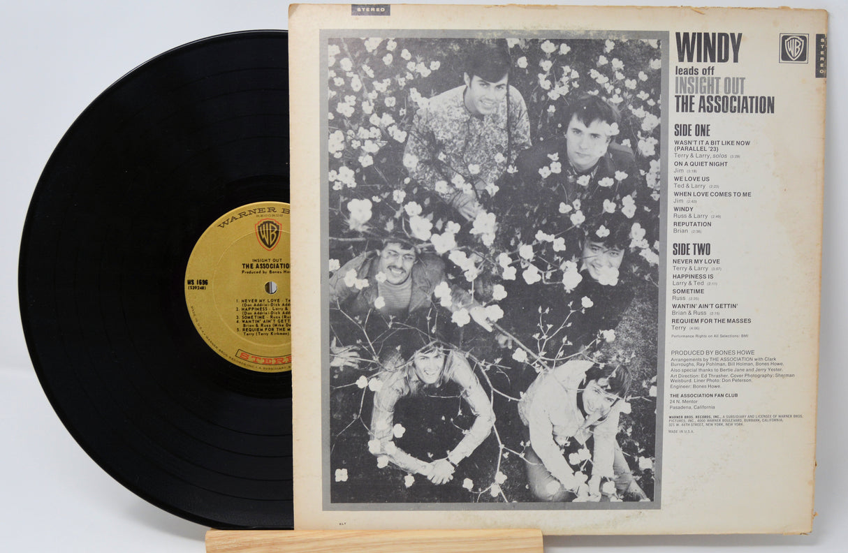 Vinyl record and cover with 'Windy' by The Association on a white background