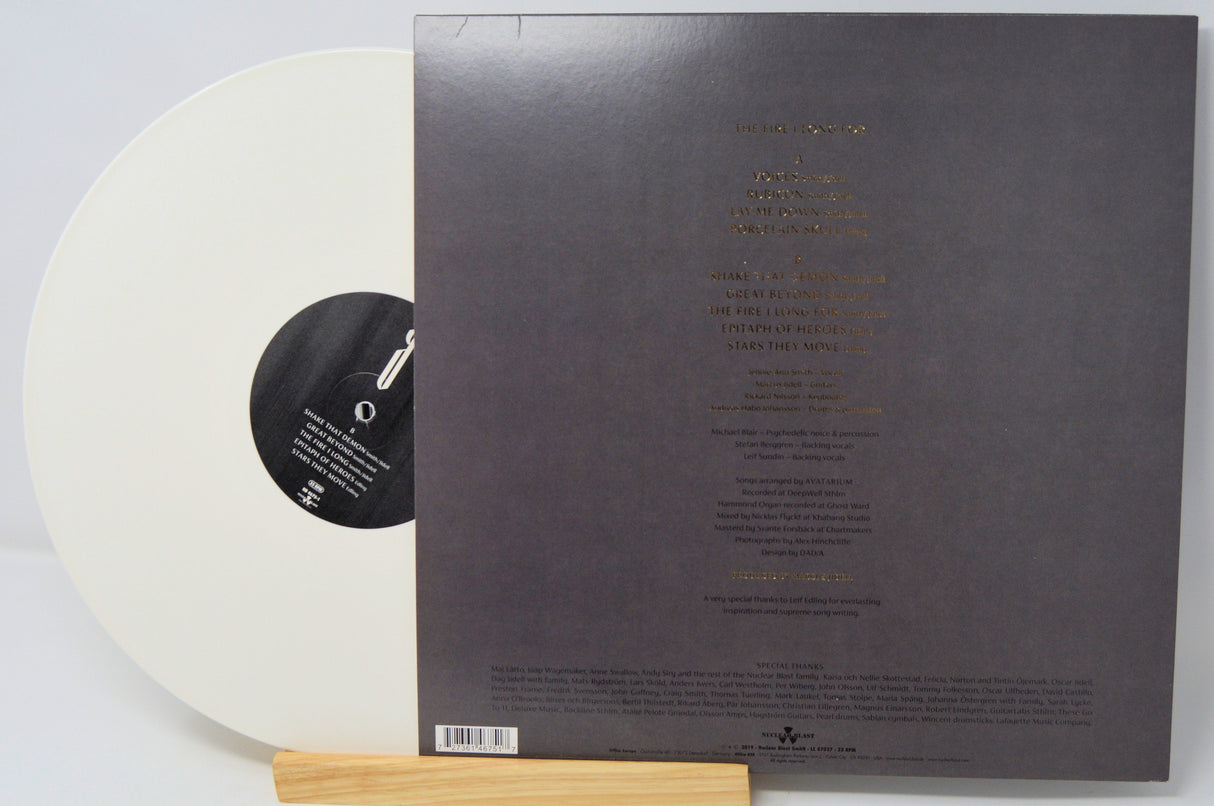 Back cover and white vinyl record of Avatarium's 'The Fire I Long For' LP with tracklist and information