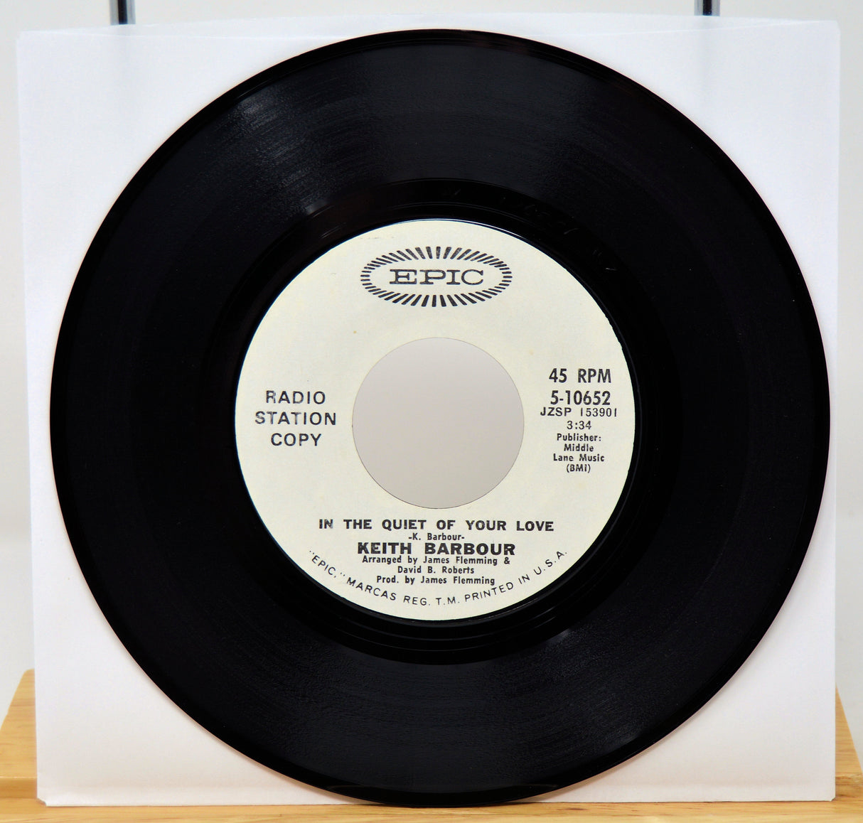 Vinyl record with 'Epic' label on a white background