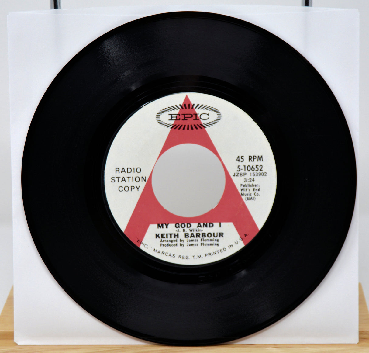 Vinyl record with a white label featuring 'Epic' records branding on a white background.