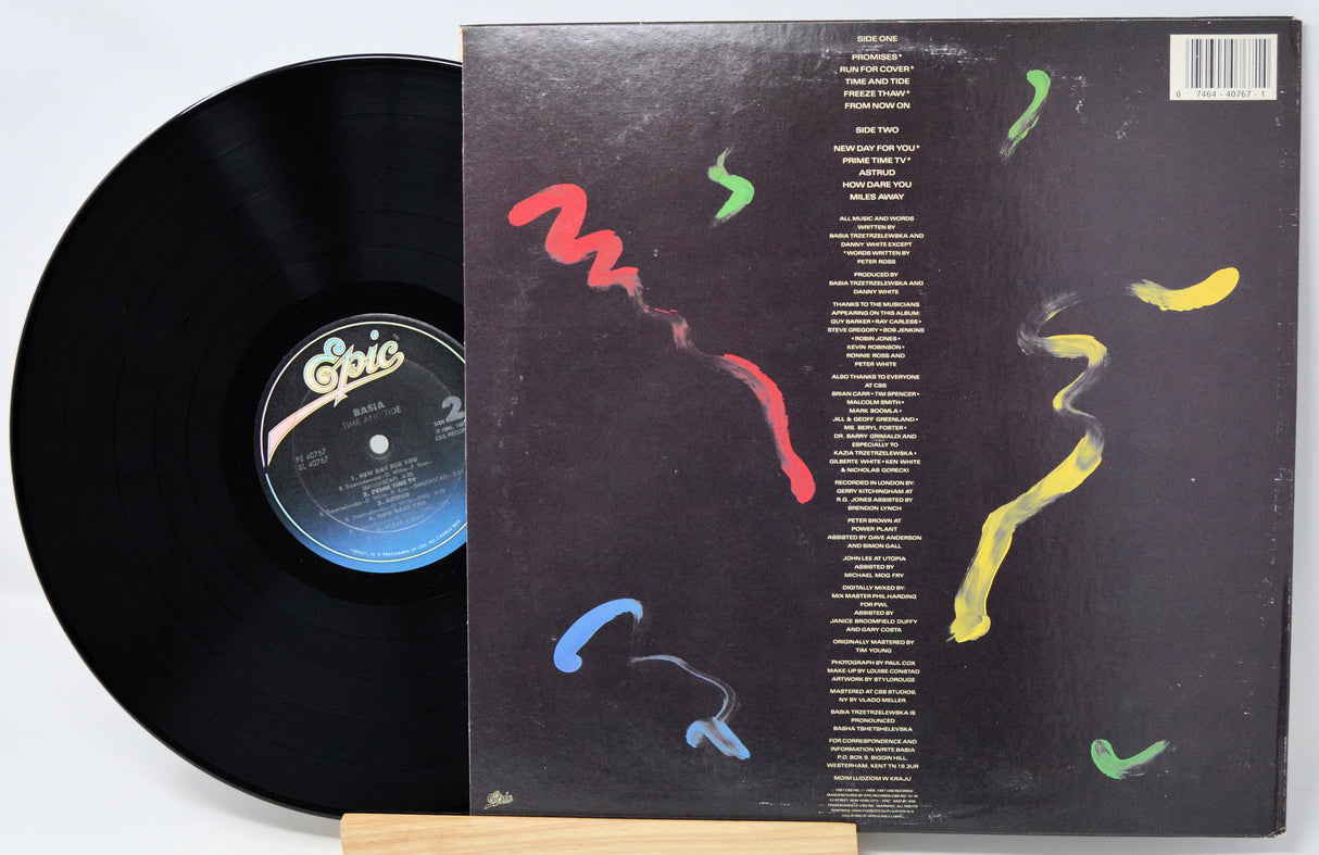 Vinyl record with a colorful album cover on a white background