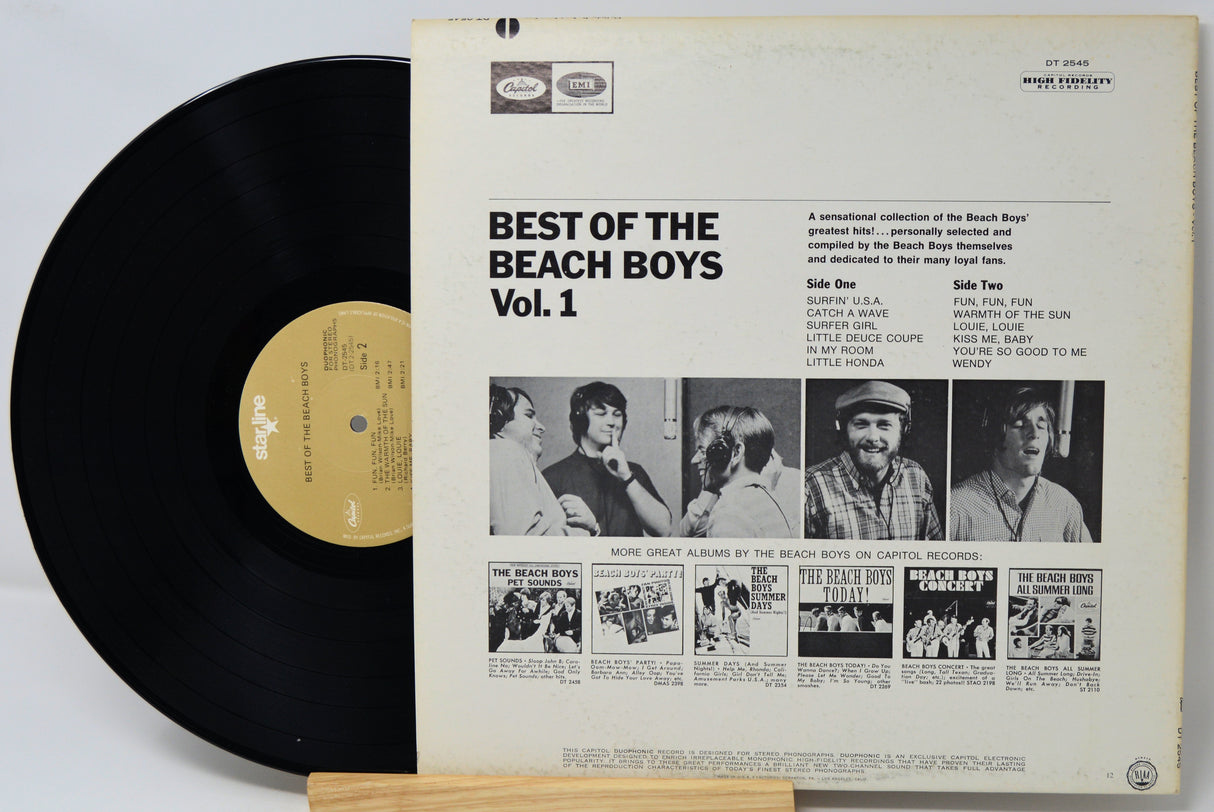 Vinyl record with 'Best of the Beach Boys Vol. 1' album cover on a white background