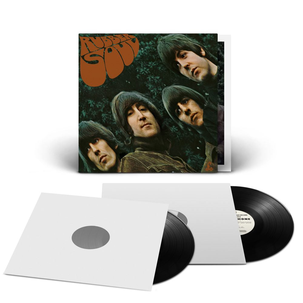A vinyl record album set displayed on a white background, featuring a square album cover with a dark green portrait collage and orange text, a white outer sleeve, and two black LP records partially pulled from the sleeve.