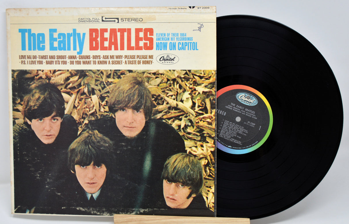 Vinyl record and cover featuring The Beatles with a white background