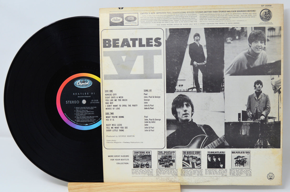 Vinyl record with its cover featuring The Beatles' 'Abbey Road' album.