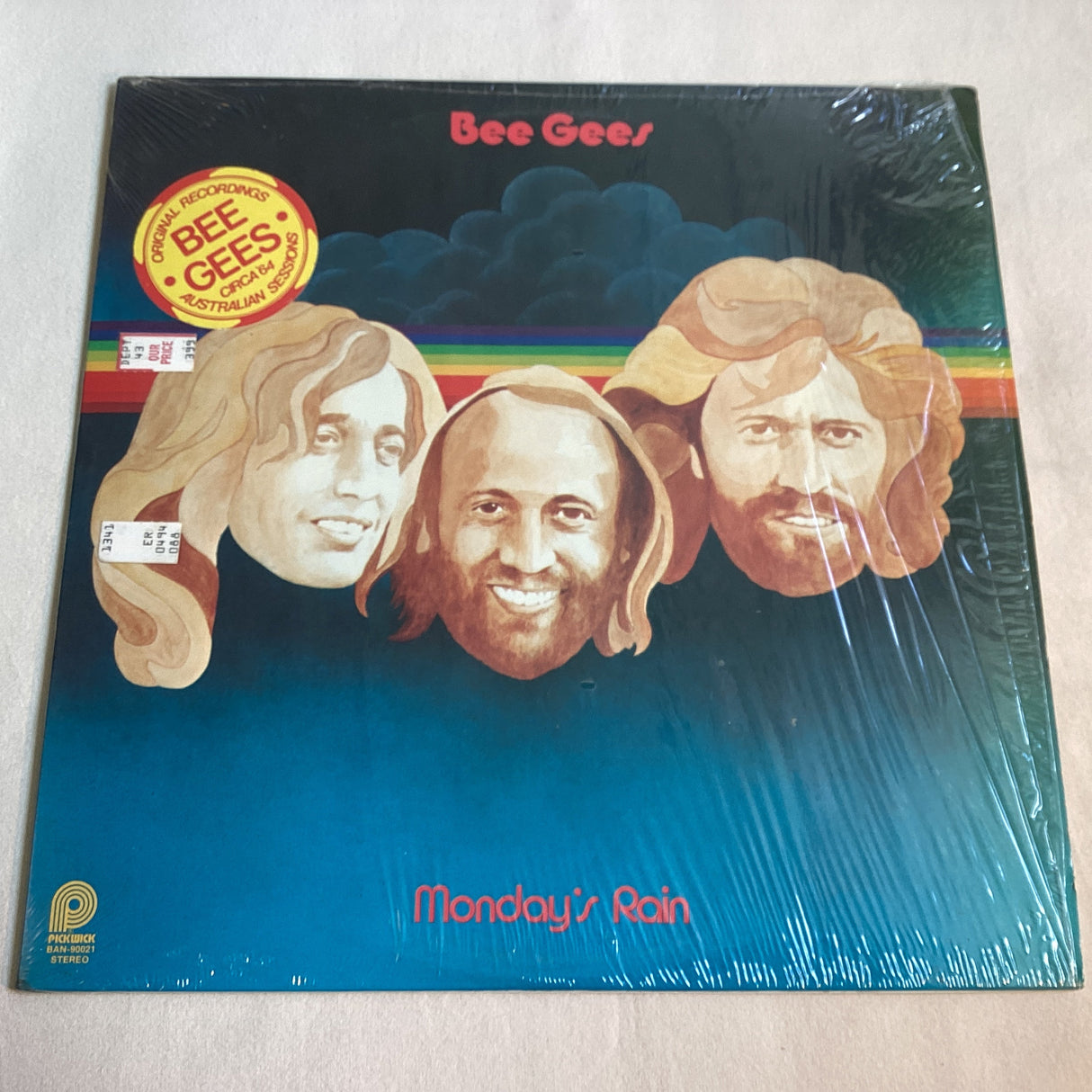 Front cover of Bee Gees Monday's Rain album featuring illustrated portraits of the Bee Gees