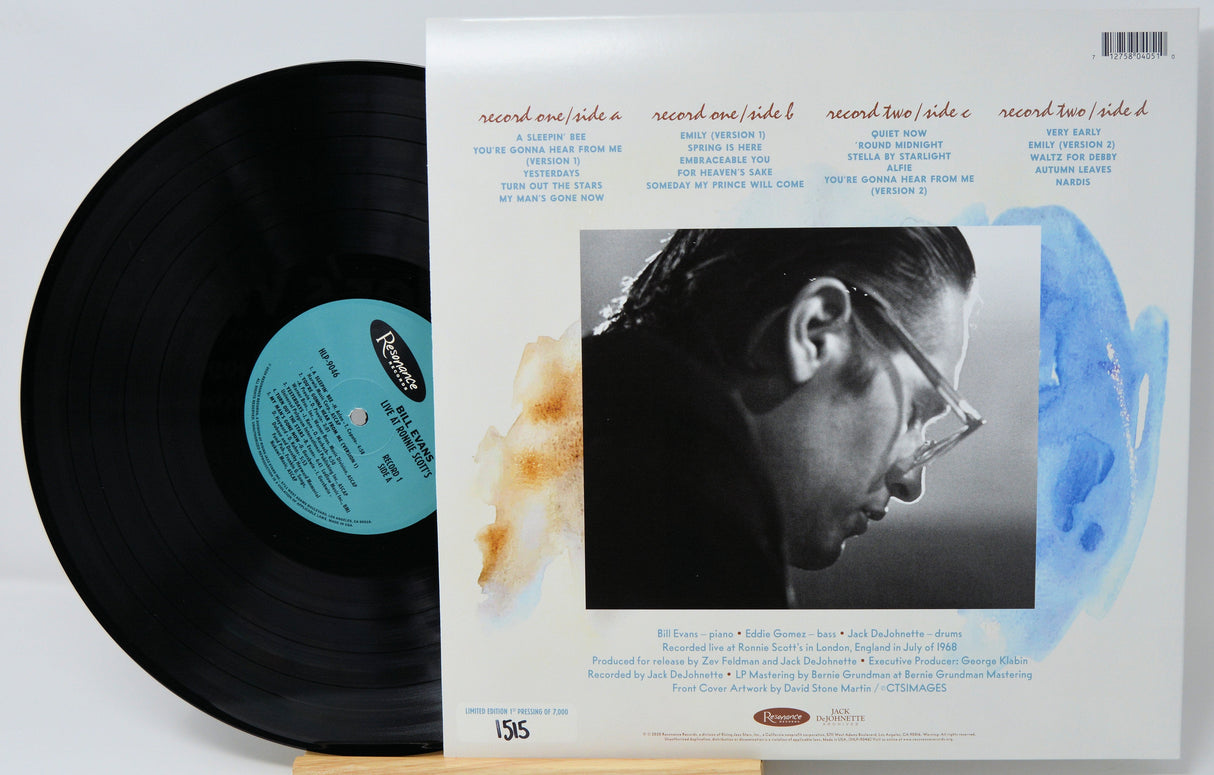 Back cover and vinyl record of Bill Evans Live at Ronnie Scott's, listing tracks and musicians, with Evans' portrait