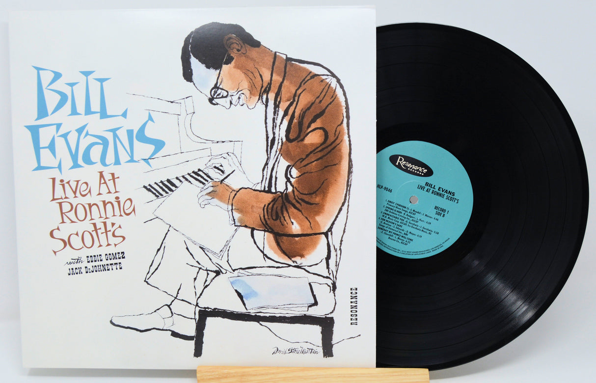 Front cover artwork and vinyl record of Bill Evans Live at Ronnie Scott's, with illustrated portrait at piano