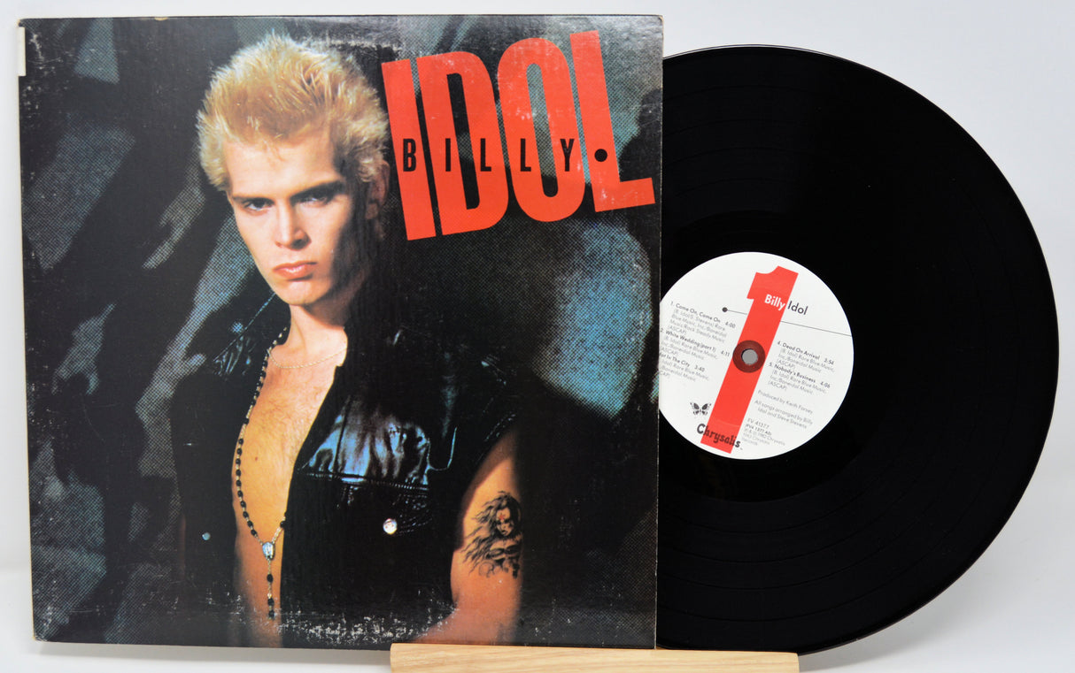 Vinyl record with cover featuring a person and the word 'IDOL' on a white background