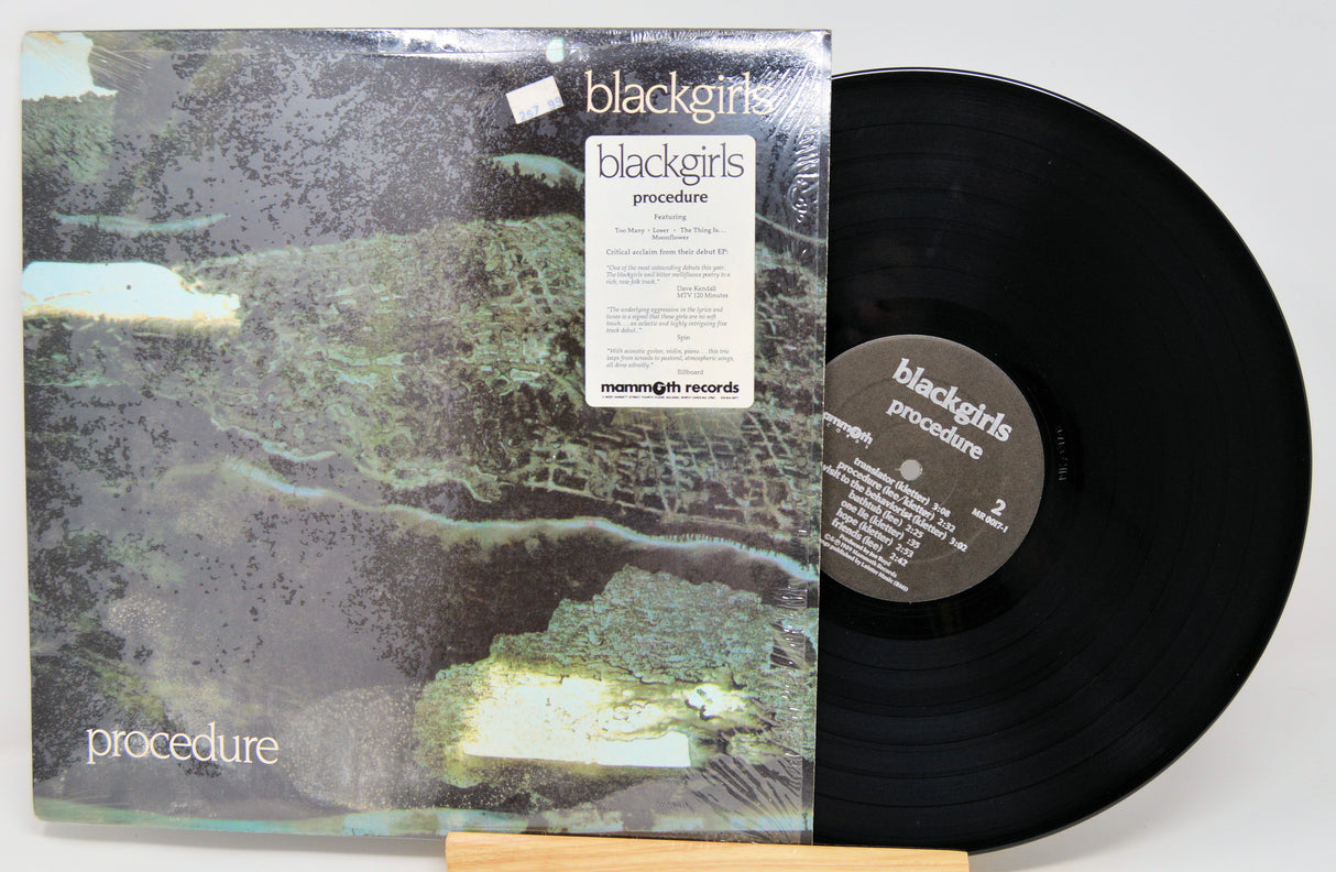 Vinyl record with cover titled 'procedure' by blackgirls on a white background