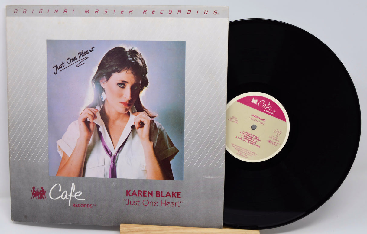 Vinyl record with cover featuring a woman and 'Cafe' branding