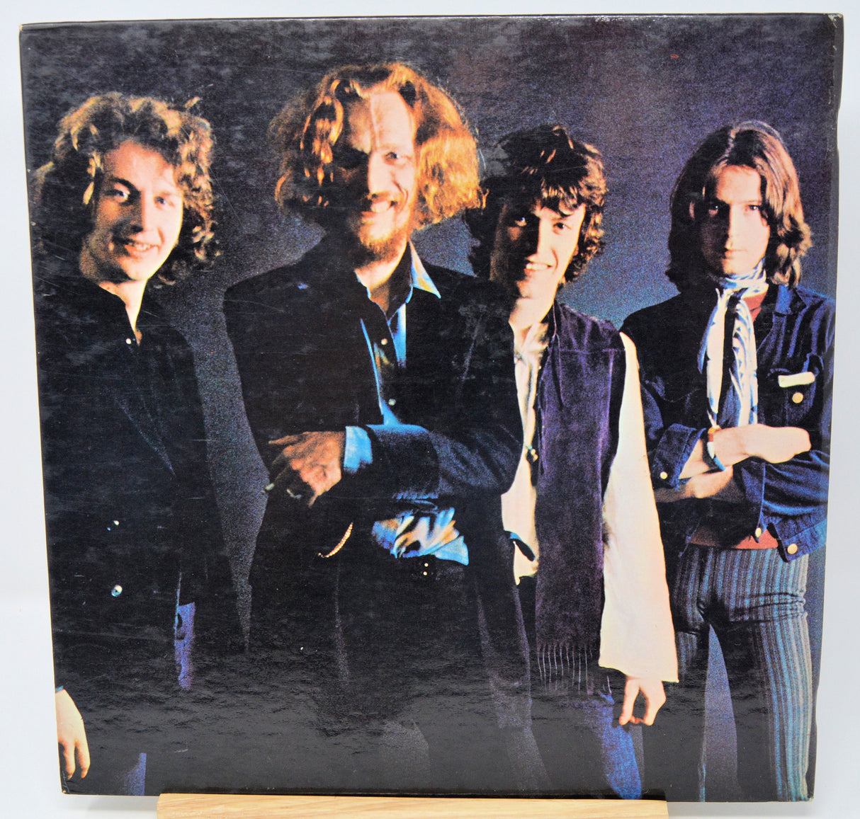 Front cover photo of Blind Faith band members smiling