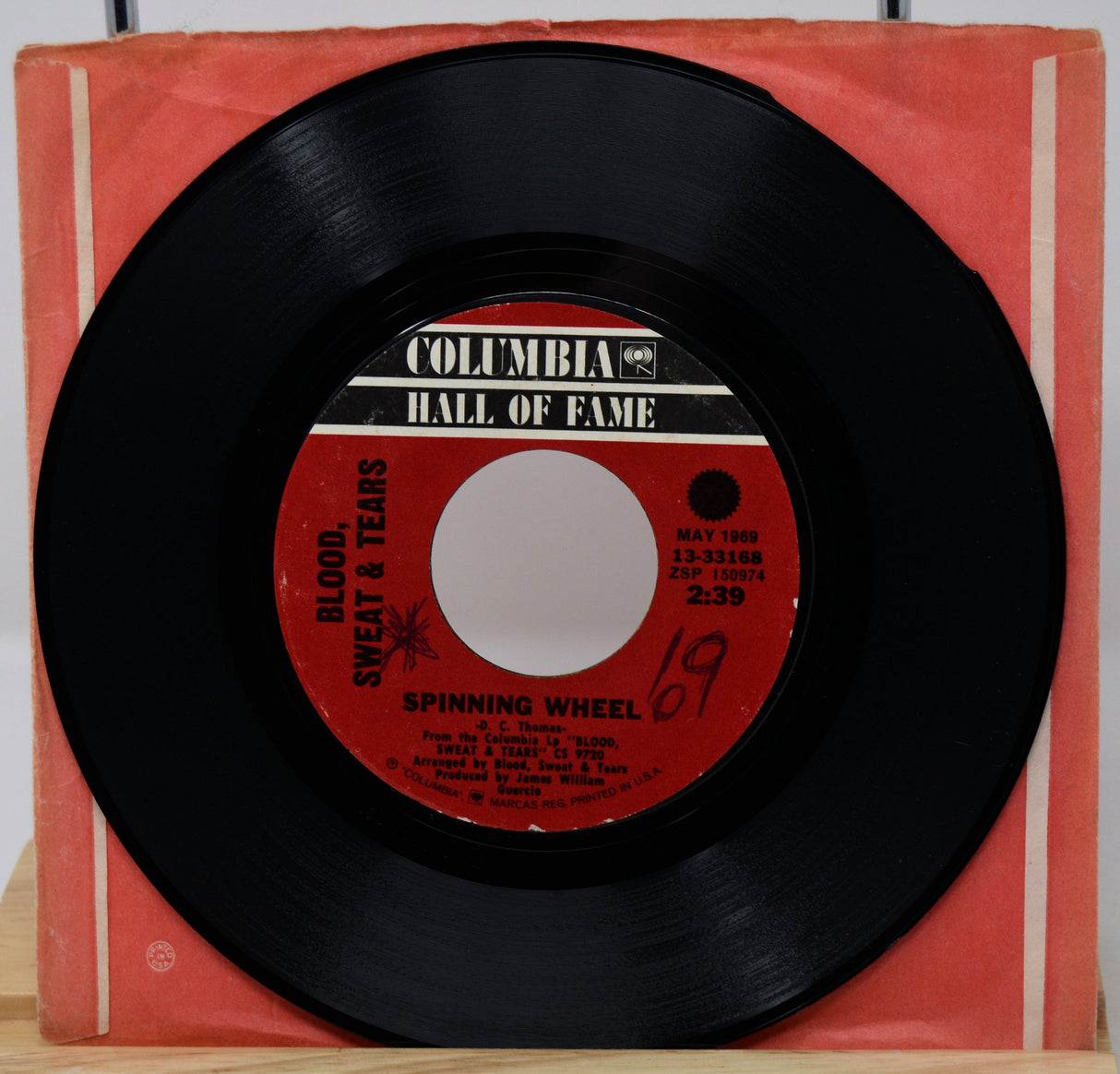 Vinyl record with red label on a red Columbia Hall of Fame sleeve