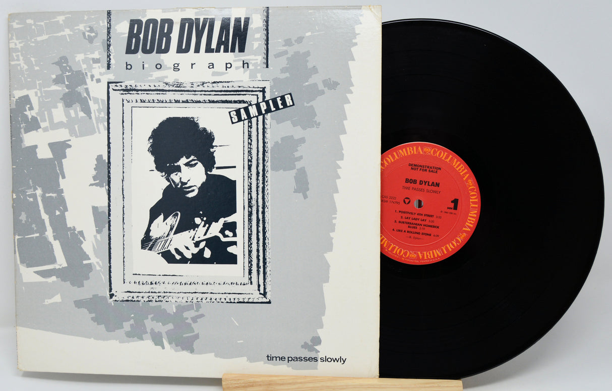 Vinyl record with Bob Dylan album cover showing a portrait and text.