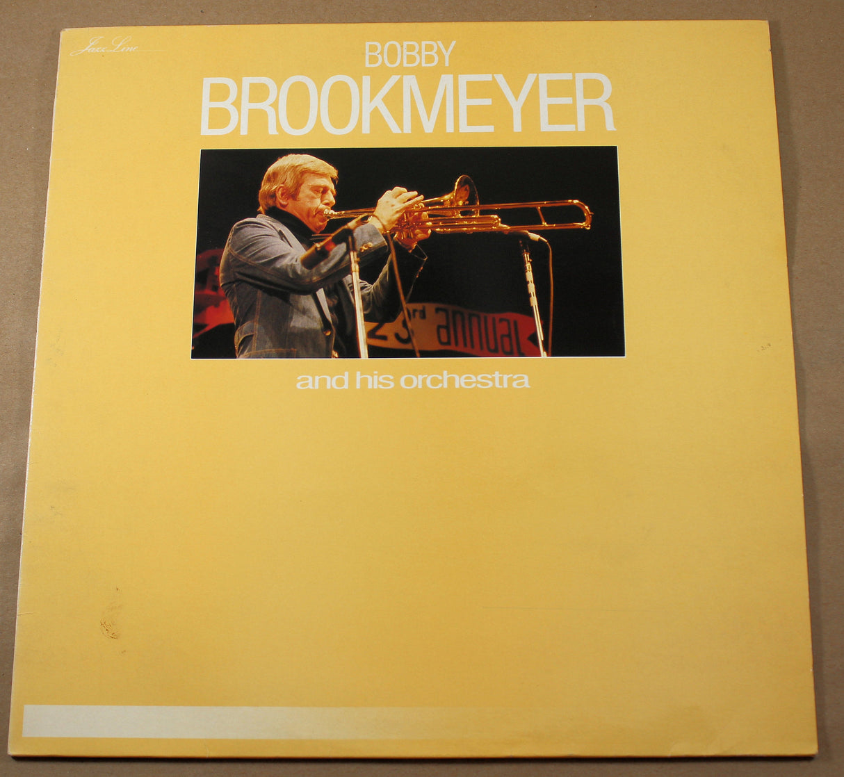 Front cover of Bobby Brookmeyer and His Orchestra vinyl LP featuring Bobby playing trombone