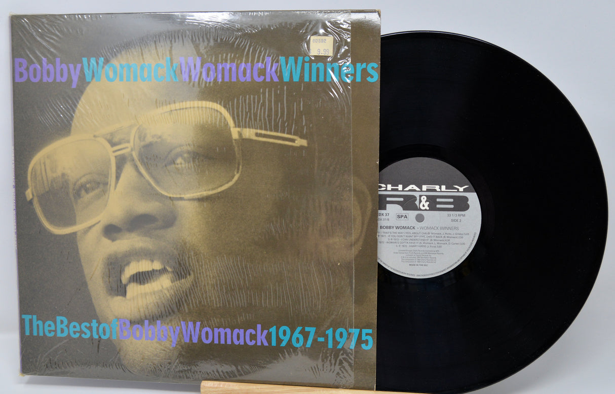Vinyl record with cover featuring a person wearing sunglasses, labeled 'The Best of Bobby Womack 1967-1975'.