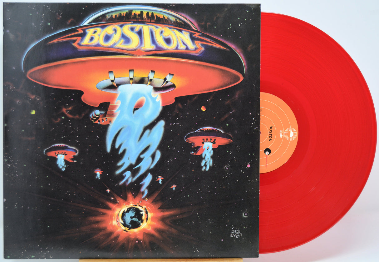 Vinyl record with a colorful cover featuring UFOs and the word 'Boston'.