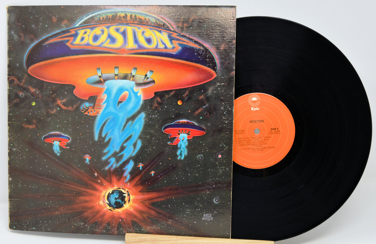 Vinyl record with a colorful cover featuring 'Boston' and space-themed design.