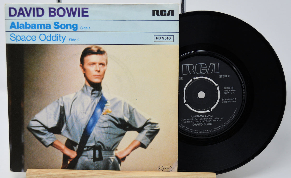 Vinyl record with David Bowie album cover featuring a space-themed outfit