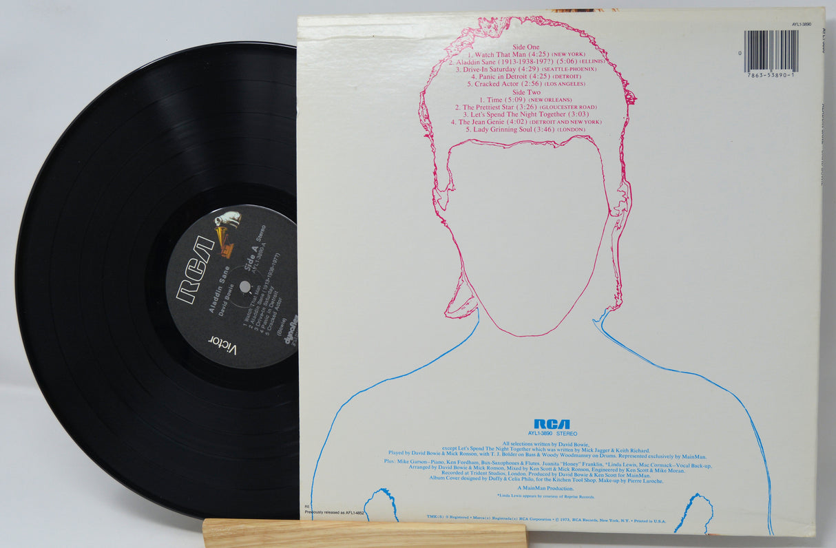 Vinyl record with a white cover featuring a face outline and RCA logo.