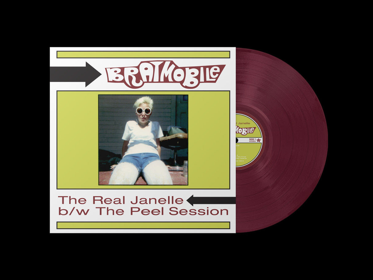 Bratmobile The Real Janelle vinyl record with cover artwork featuring a woman in sunglasses