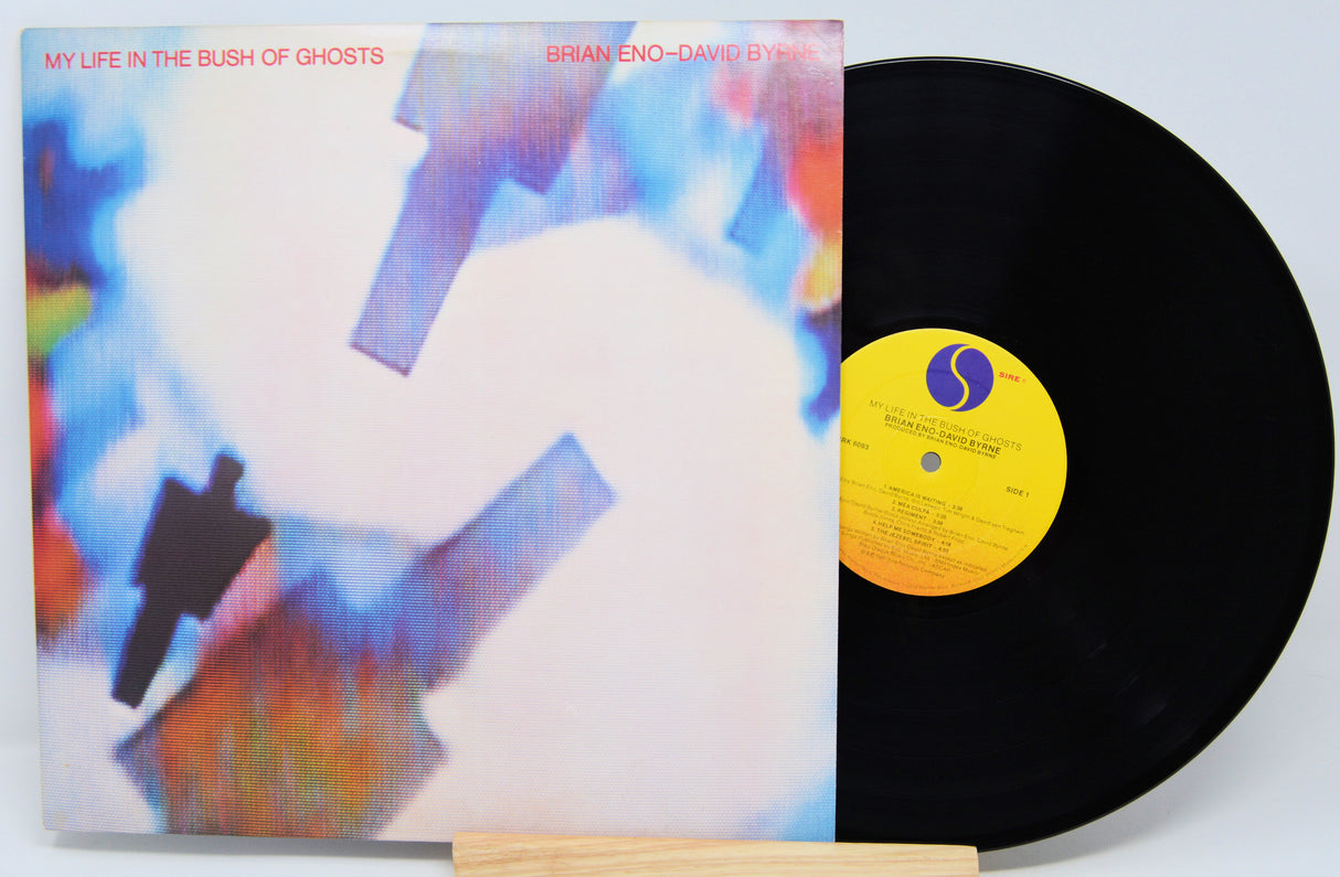 Vinyl record with cover titled 'My Life in the Bush of Ghosts' by Brian Eno and David Byrne.