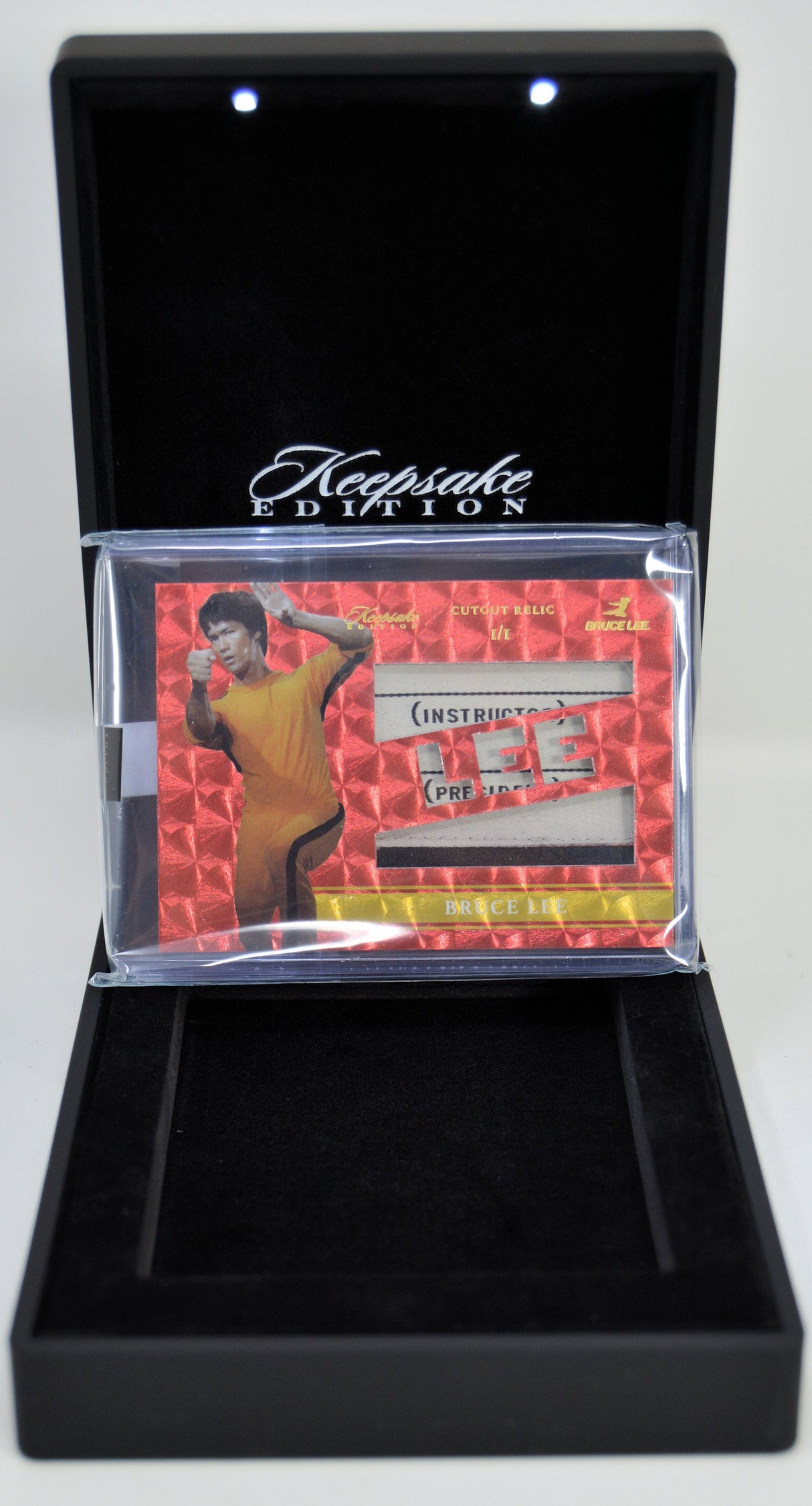 Bruce Lee Keepsake Edition relic card displayed in open presentation case