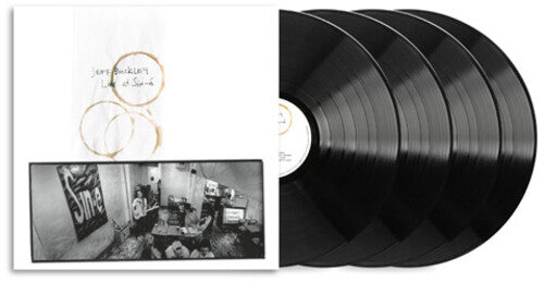 Four black vinyl records with a white cover featuring a black and white photo and text.