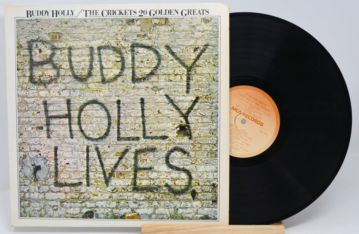 Used vinyl record of Buddy Holly album 'Buddy Holly Lives' with a black and white cover featuring the title and artist name.