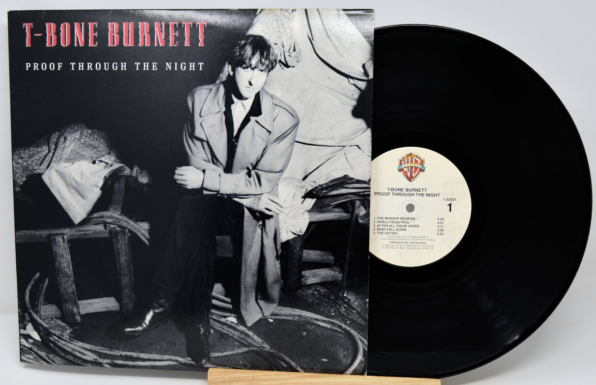 Vinyl record with cover featuring T-Bone Burnett and album title 'Proof Through the Night'.