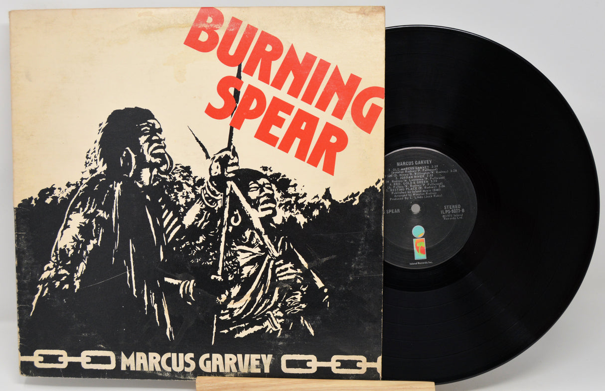 Vinyl record with 'Burning Spear' album cover featuring a figure holding a spear.