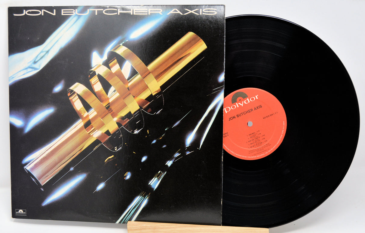 A vinyl record titled 'Jon Butcher Axis' with the band's name and logo on the cover, displaying a black background with metallic elements and text.