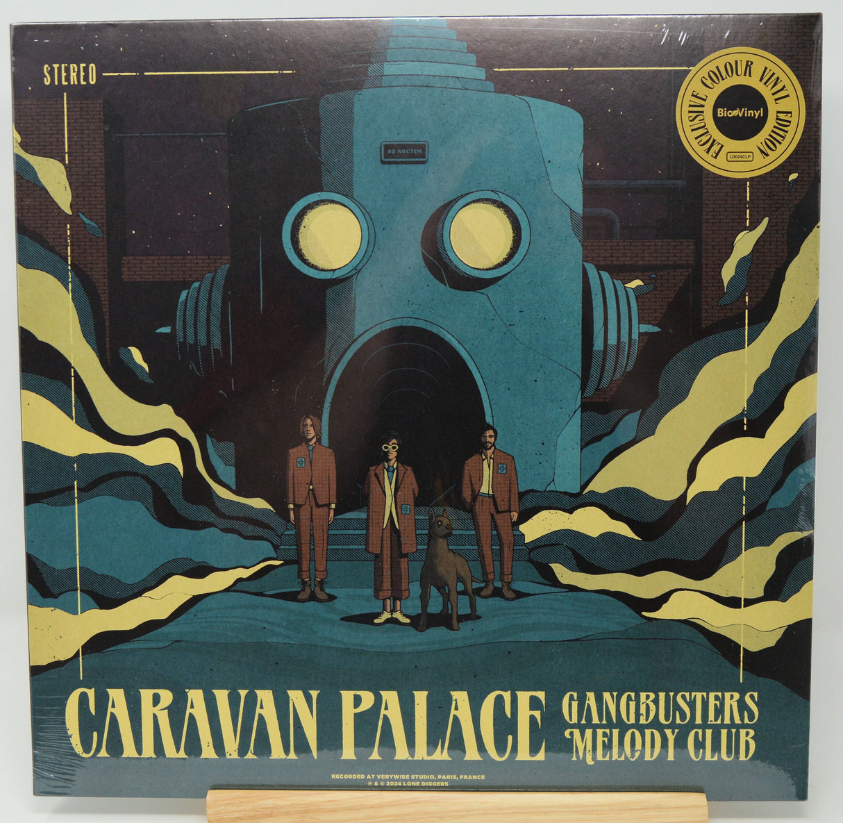 Vinyl record cover for Caravan Palace's 'Gangbusters Melody Club' with a futuristic design and text.